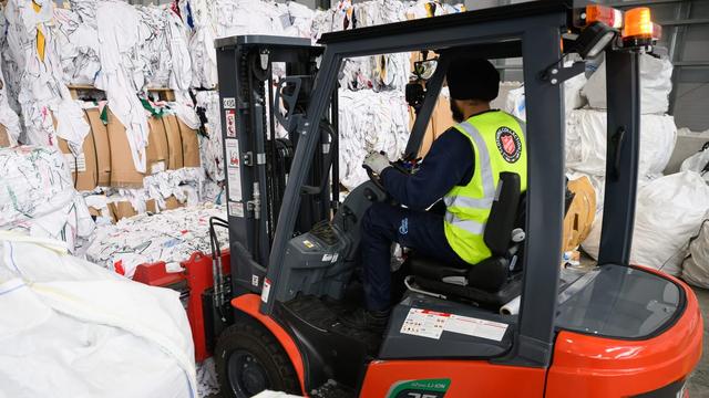A forklift in a textile recycling centre. | Leon Neal/Getty Images