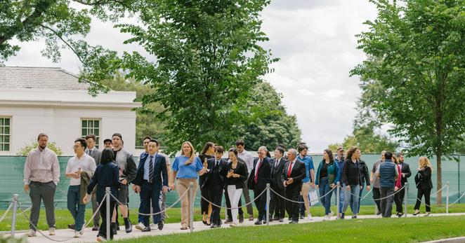 Guests of the dinner taking a private tour of the White House on Friday.