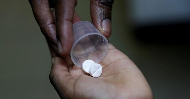 Dispensing an antiretroviral drug used to treat H.I.V. at the Nyumbani Children’s Home in Nairobi, Kenya, in February.
