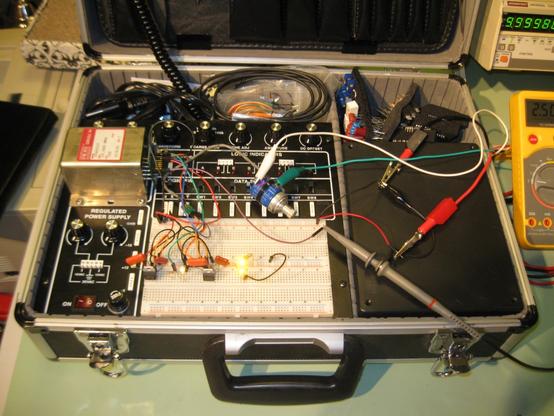 A photo of the project on a breadboard in a briefcase.