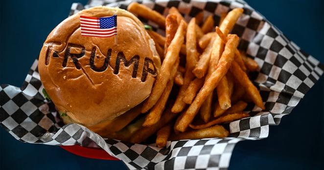 TOPSHOT - A burger is seen at Trump Burger restaurant, in Bellville, Texas, on April 19, 2025. It is lunchtime at a Texas eatery called Trump Burger and diners are enjoying fast food and the frenetic first 100 days of their president's second term. Trump is everywhere in this joint with a dozen tables -- in cardboard cutouts of the man eking out his trademark forced smile, on banners from the 2024 campaign, and on hats and T-shirts displayed for sale. It is a franchise of a company with four such Trump-themed outlets in Texas and no equal anywhere else in America. The chain is not linked to the Trump Organization.