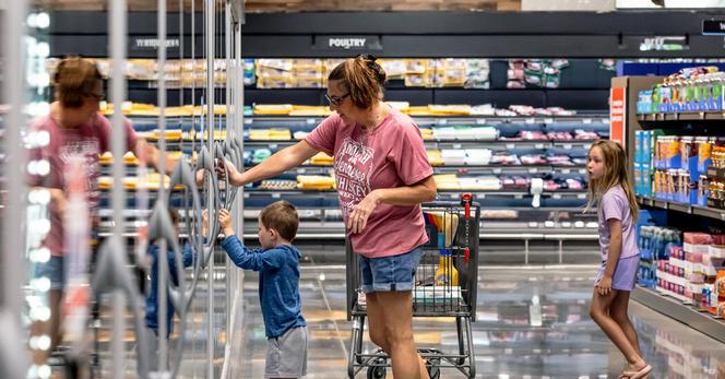 In the aisle of a grocery store in Westlake, Fla. Americans have become choosier about how they spend.