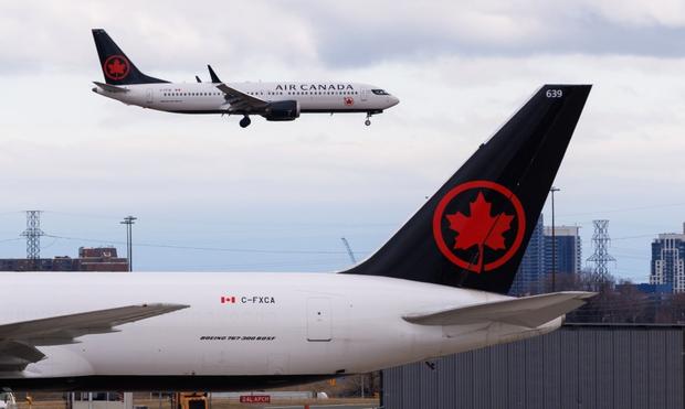 Air Canada suspend restart; China’s economy slows in July