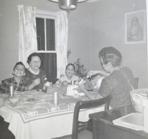 In this undated photo, Pope Leo XIV (then Robert Prevost) (left) smiles while his mother (back to the camera) cuts a birthday cake in what his brother (right) guessed was the pope In this undated photo, Pope Leo XIV (then Robert Prevost) (left) smiles while his mother (back to the camera) cuts a birthday cake in what his brother (right) guessed was the pope