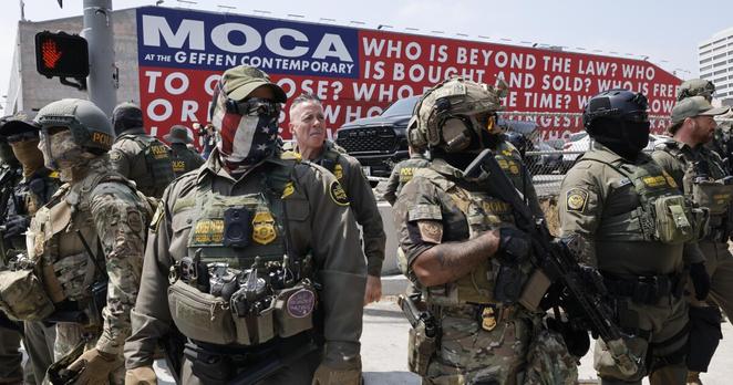Los Angeles, CA - August 14: US Border Patrol march to the Edward R. Roybal Federal Building after a show of force outside the Japanese American National Museum where Gov. Newsom was holding a redistricting press conference on Thursday, Aug. 14, 2025 in Los Angeles, CA. (Carlin Stiehl / Los Angeles Times) Los Angeles, CA - August 14: US Border Patrol march to the Edward R. Roybal Federal Building after a show of force outside the Japanese American National Museum where Gov. Newsom was holding a redistricting press conference on Thursday, Aug. 14, 2025 in Los Angeles, CA. (Carlin Stiehl / Los Angeles Times)