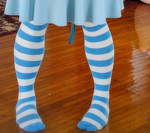 my legs in blue/white striped socks