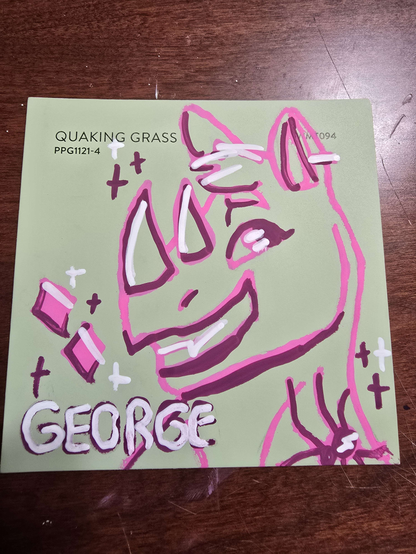 a mint green paint swatch with a doodle of an anthro rhino in pink posca with darker pink and white accents