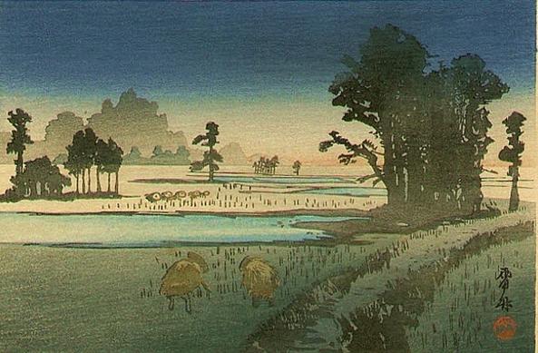 Landscape with two people working in rice fields in the foreground.