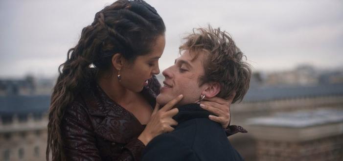 This image released by Apple TV+ shows Lyna Khoudri, left, and Benjamin Voisin in a scene from