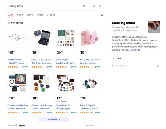 Searching for "reading stone"; the thing I was actually searching for can be seen on the right, via Wikipedia.  The first result under shopping is for reading glasses, which is close.  Everything else under shopping is irrelevant.