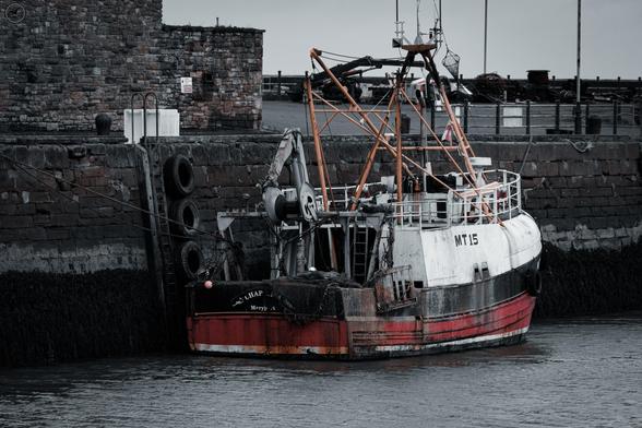 Old trawler at dock