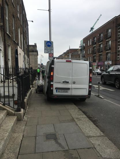 Van takes up the pavement and cycle lane, with a machine powering the pump for the window cleaner's tools blocking the free half of the pavement - Dublin, May 2025