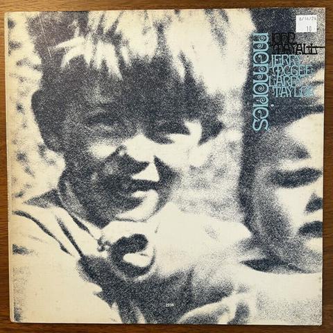 John Mayall Memories front cover – with a mezzotinted photograph of a young boy (Mayall) with a thick mop of hair, protruding ears and an open-mouthed but perhaps not smiling expression. He appears to be holding an infant, only half of which appears in the frame and has a face of typical infant distress.