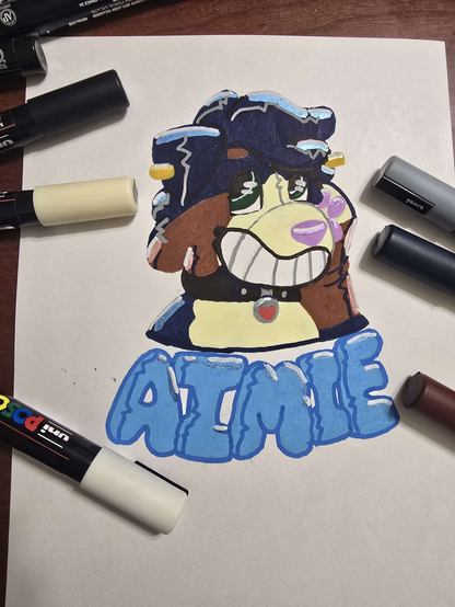 a posca bust drawing of an anthro bernese dog pooltoy, shes navy blue base with brown accents and a cream snout and chest with a black collar, under the bust is the name AIMIE in light blue pooltoy letters