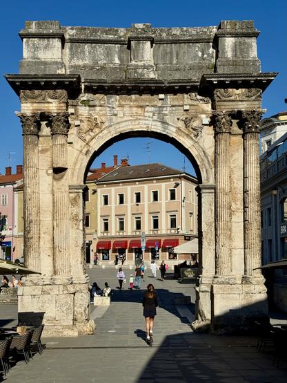 A fine example of early Roman architecture, richly decorated with Corinthian columns and friezes. It once served as a city gate.
