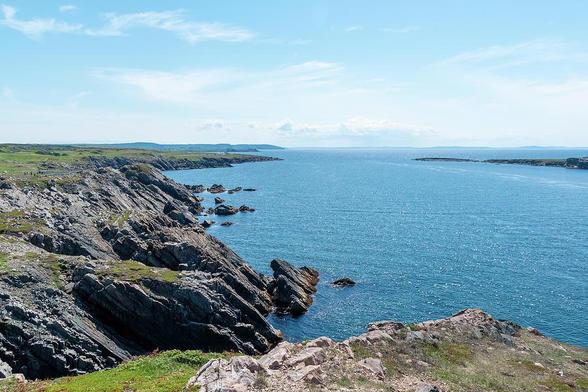 The rocky shoreline of the Bonavista Peninsula in Newfoundland, on the way up to Cape Bonavista is seen on a beautiful sunny day.