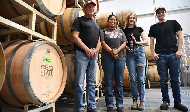 Fresno State winemaker Tom Montgomery (left) with students Malia Mora, Preston Jenkins and Keara McVicker.