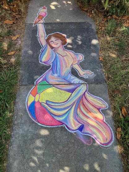 A colorful chalk drawing on pavement, of a joyful woman with brown hair, sitting on a beachball, waving an icecream cone overhead, wearing a rainbow-colored flowy gown.