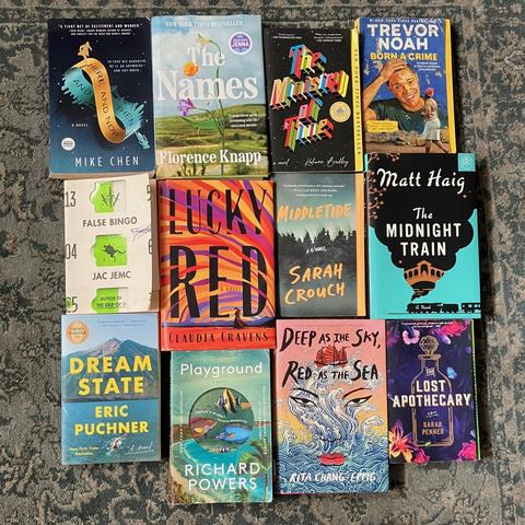 An array of twelve books (list in main post), in three rows of four books.