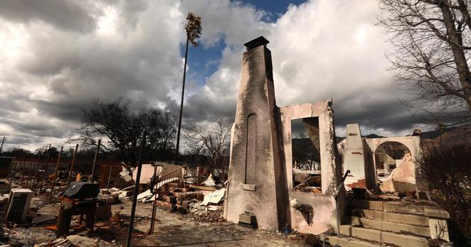ALTADENA, CA - MARCH 13, 2025 - - A chimney, a door frame and steps are all that remains of a home destroyed in the Eaton fire along McNally Avenue in Altadena on March 13, 2025. (Genaro Molina/Los Angeles Times)