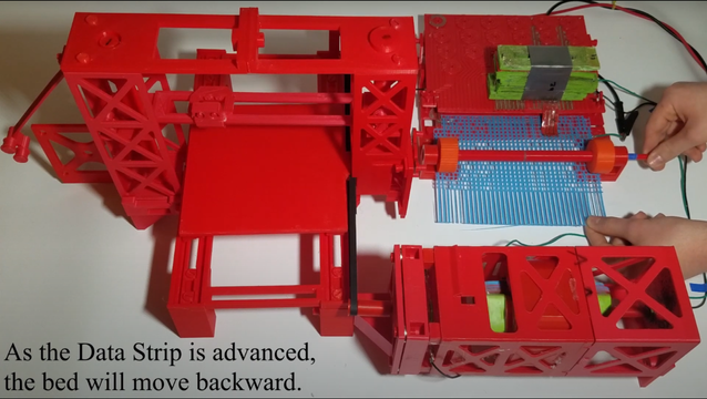 A 3D printer frame made of red plastic is shown on the left-hand side of the image. On the right-hand side, there is a large motor with a plastic frame attached to the frame. Next to the 3D printer, a blue plastic mesh is being fed through a red plastic frame.