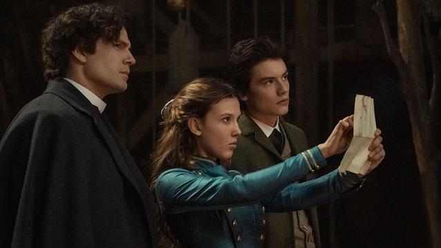 Henry Cavill as Sherlock Holmes, Millie Bobby Brown as Enola Holmes, Louis Partridge as Tewkesbury.