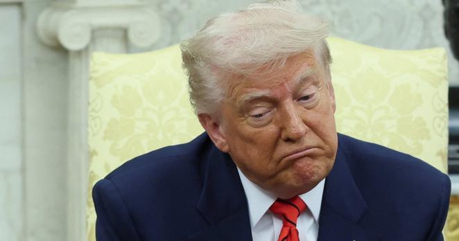 U.S. President Donald Trump reacts during a meeting with Canadian Prime Minister Mark Carney (not pictured) in the Oval Office at the White House in Washington, D.C., U.S., May 6, 2025.