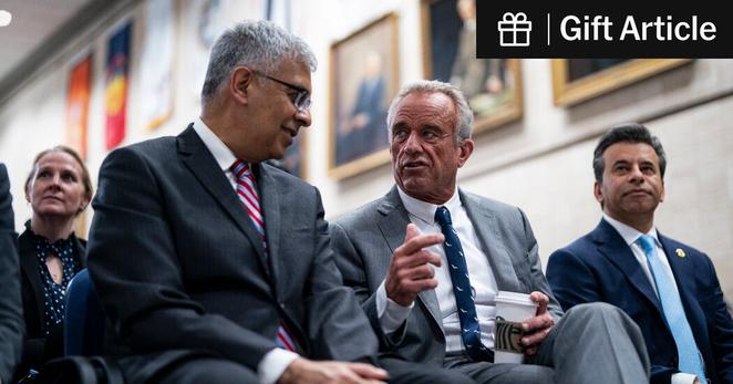 Dr. Jay Bhattacharya, left, the director of the National Institutes of Health, and Health Secretary Robert F. Kennedy Jr. at a news conference in Washington last month.