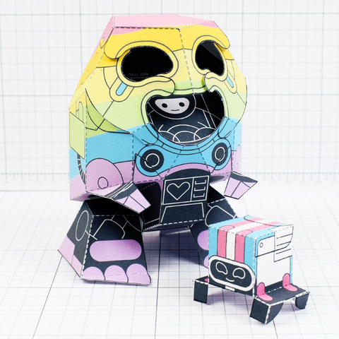 A photo of a papercraft depicting a person in a mech suit that is rainbow coloured, next to a smaller robot that is pink, blue and white 