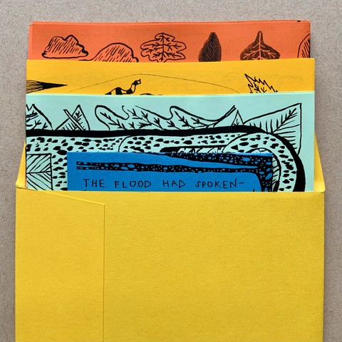 Here is the top of the envelope, open, with the four comics/zines popping up from inside. The zines are illustrated with branches, leaves, and a cloud. 