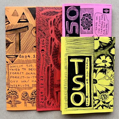 Here are the four comics taken out of the envelope. Their covers feature patterns, mushrooms, a rug, and leaves. 