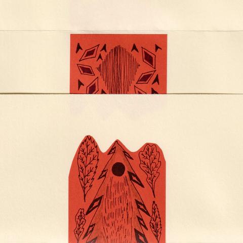 Here is one envelope opened, showing a patterned sticker design on the back and on the inside.