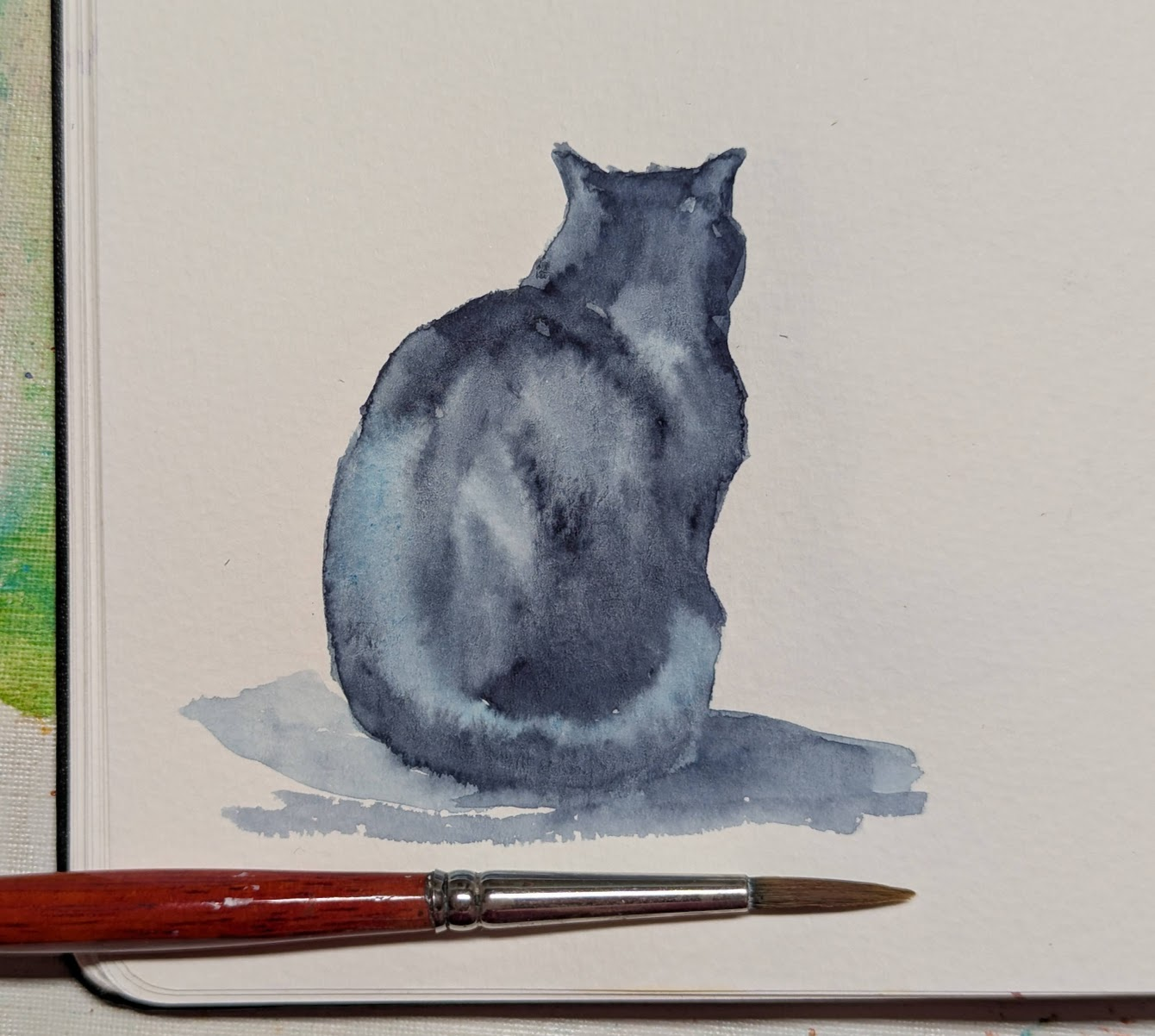 Hand-painted watercolor sketch of a cute black cat seen from behind sitting on the floor by artist Karen Kaspar