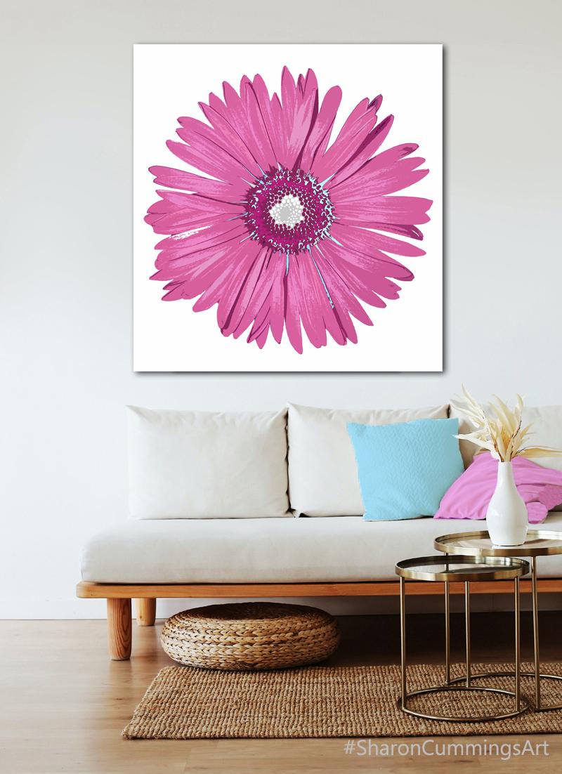 Large pink daisy on white in a decor setting by artist Sharon Cummings.