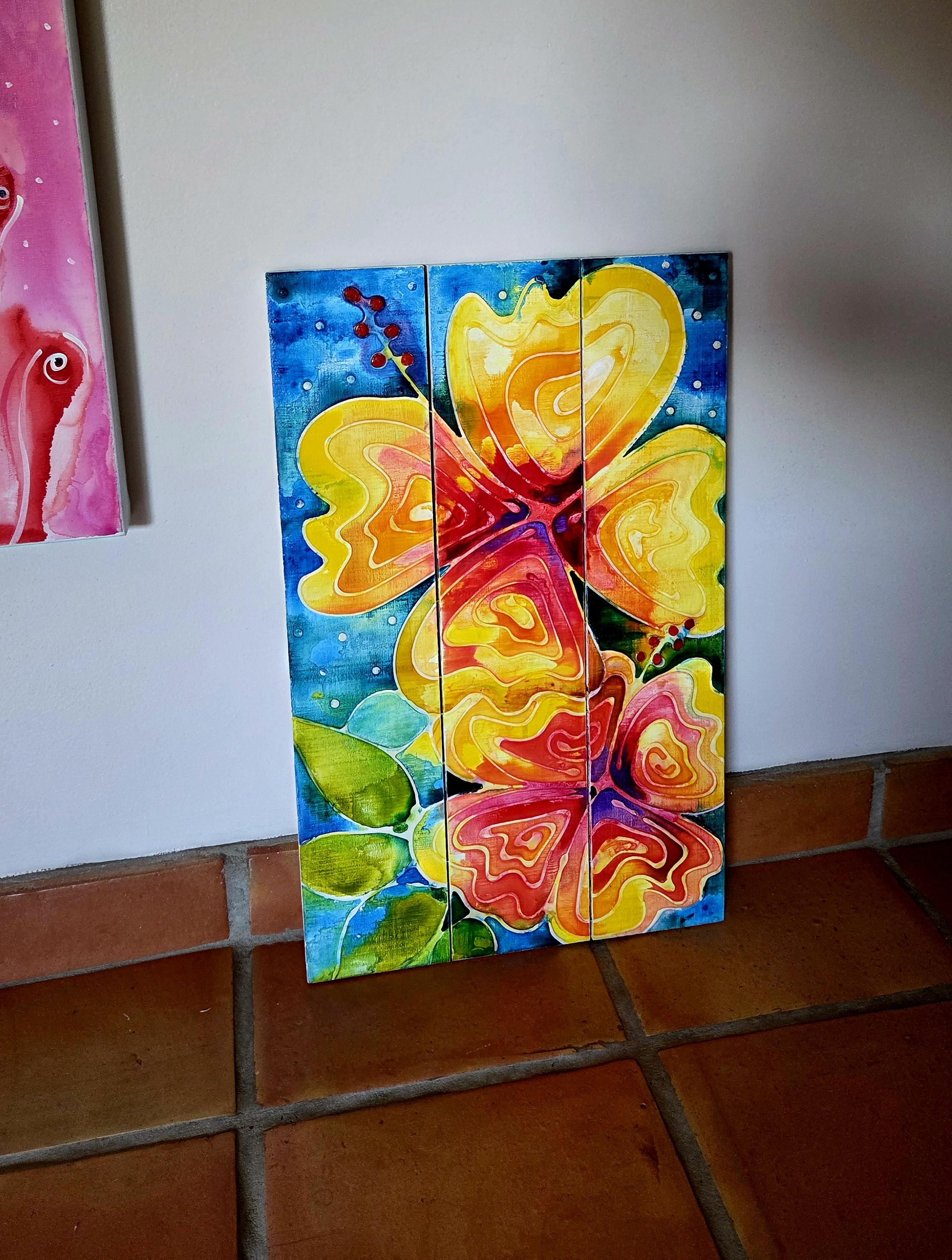 Yellow hibiscus flower painting on blue by artist Sharon Cummings.