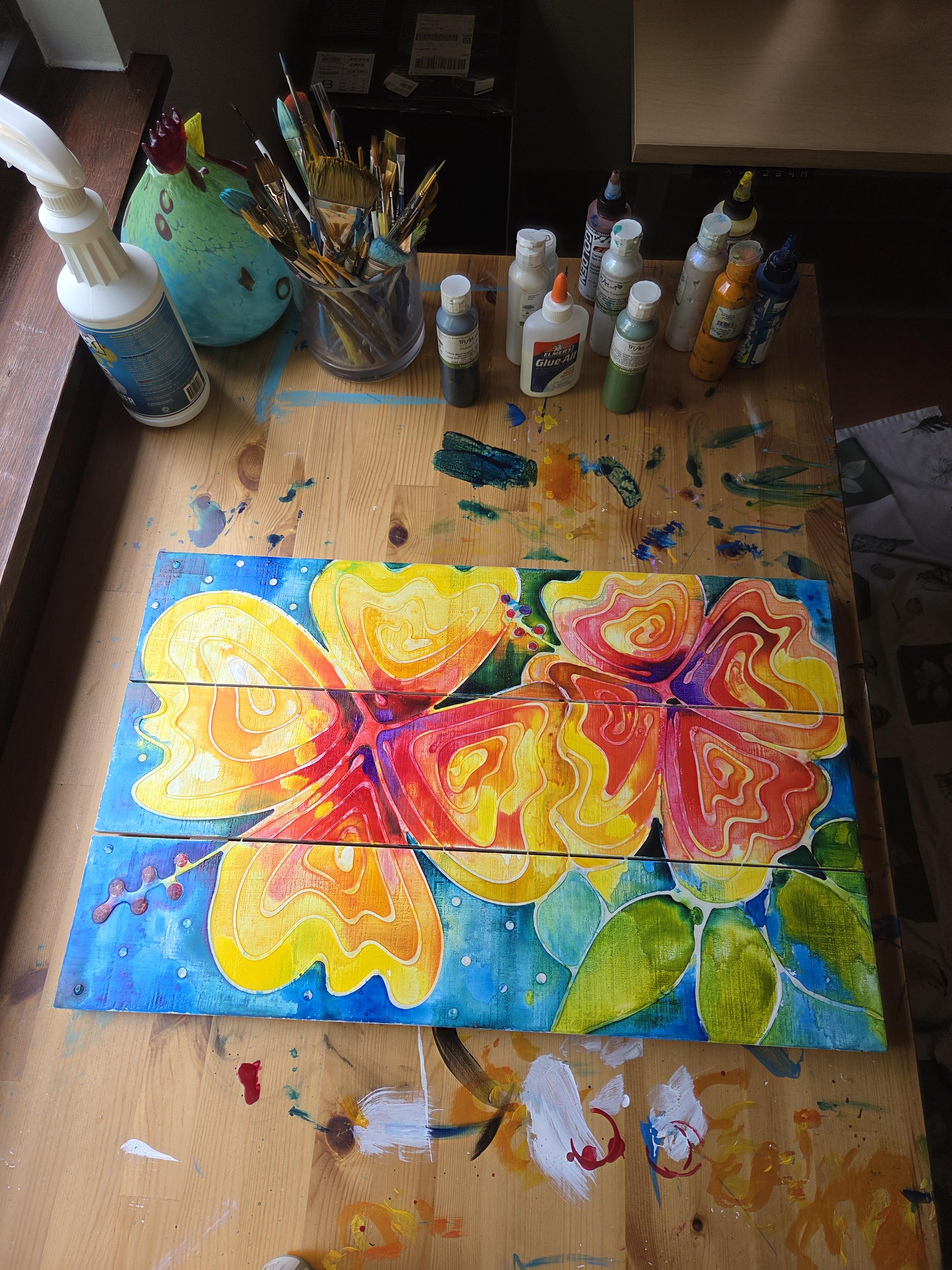 Yellow hibiscus flower painting on blue by artist Sharon Cummings.