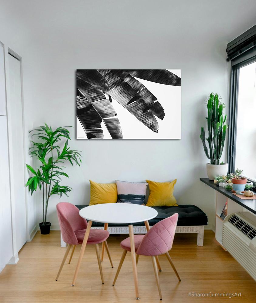 Black and white palm fronds on white in a decor setting by Sharon Cummings.