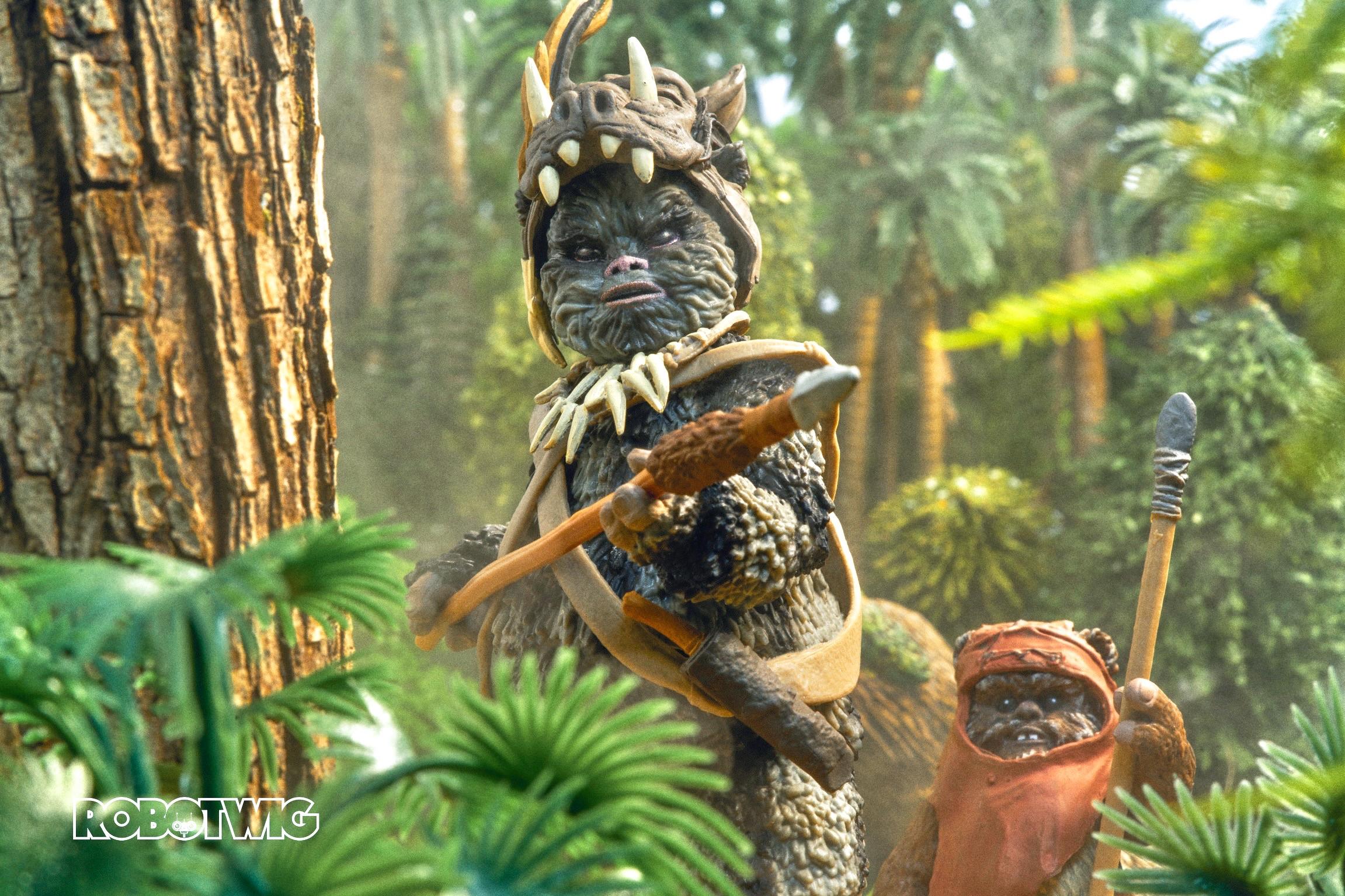 Teebo armed with a weapon cautiously approaches you whilst you're hiding behind a bush down in Endor. Wicket watches in the distance