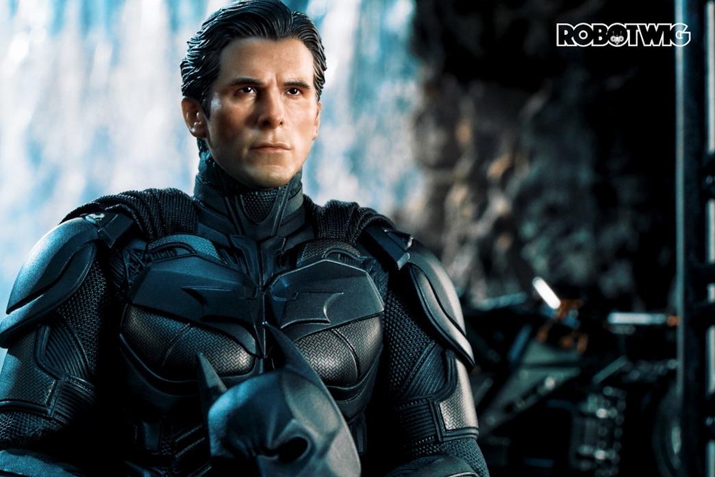 Bruce Wayne stands in BatCave suited up ready to go out and fight crime