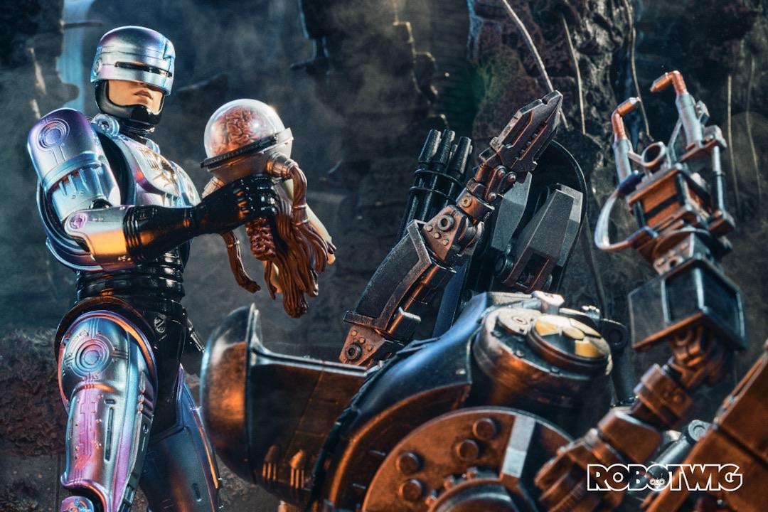 Robocop removes Caines brain from his robotic corpse and walks away as Caine lays on the ground motionless