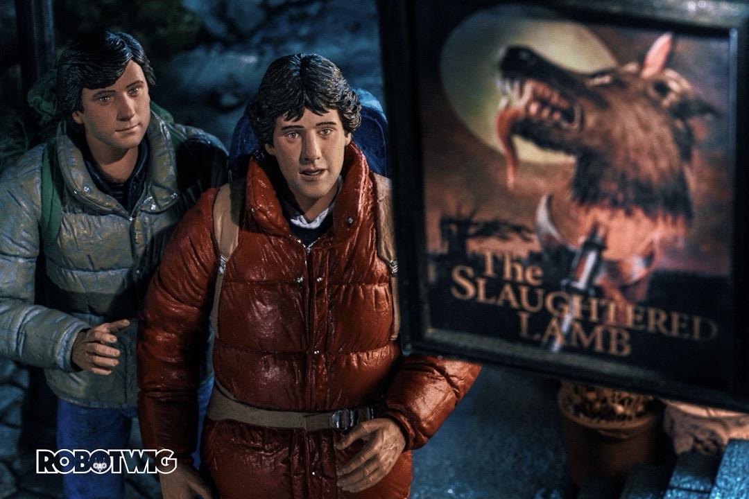 Jack and David stand underneath the Slaughtered Lamb pub sign looking a little concerned