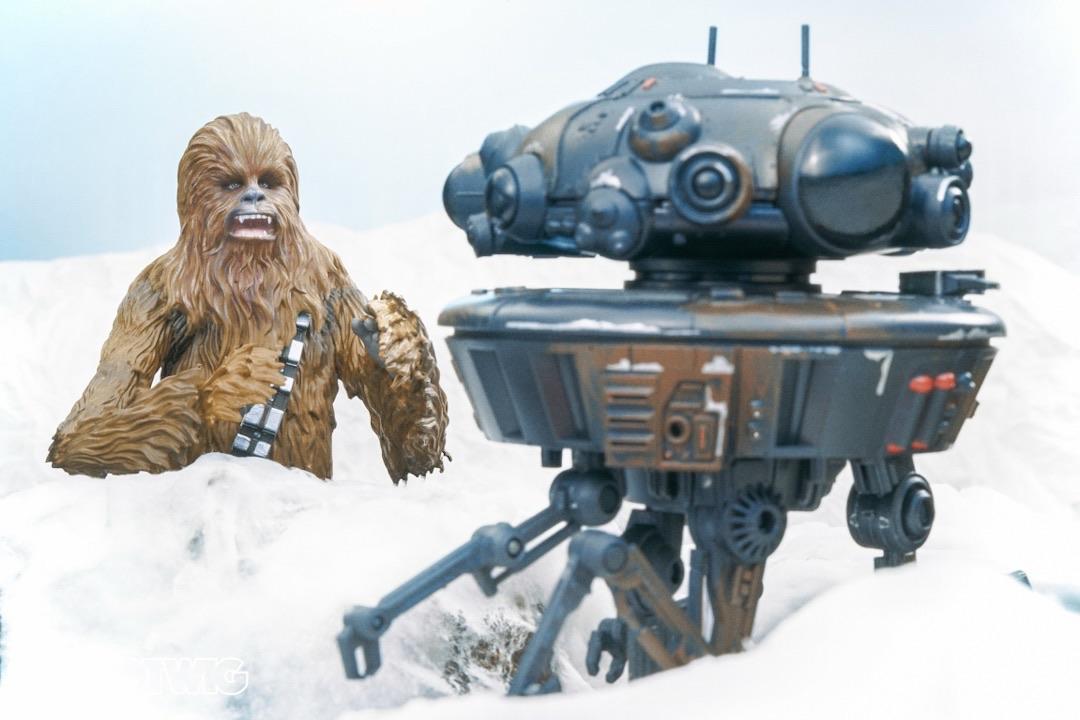 Chewbacca jumps out at a Probe Droid to distract it whilst Han shoots and blows it up.