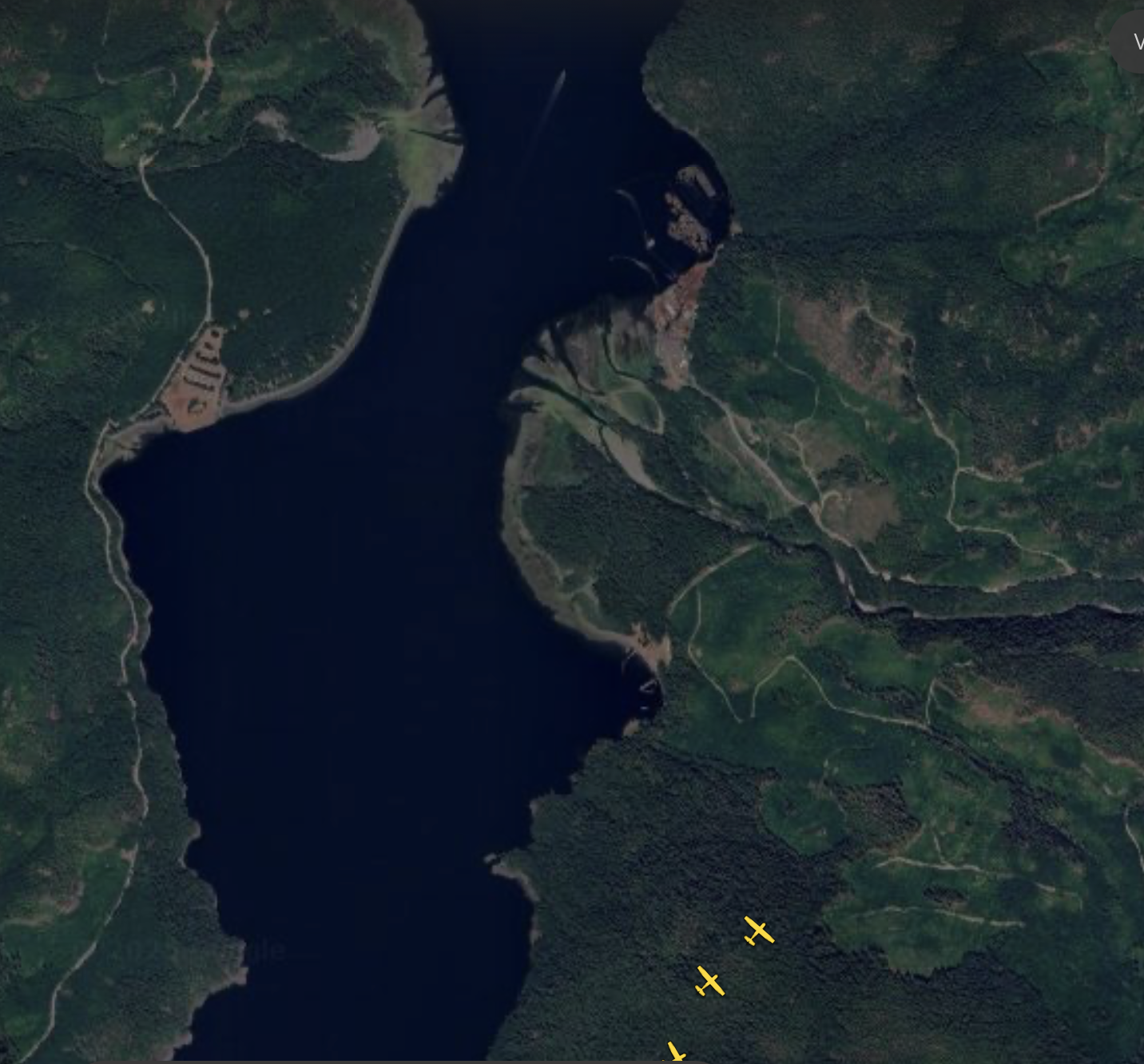 A dark screenshot shows a line of 3 planes moving to from the southwest to the north east toward a river valley that empties into the Alberni Inlet
