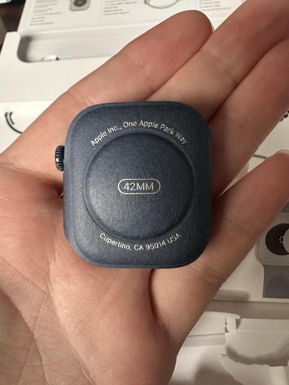 The actual watch wrapped in paper!