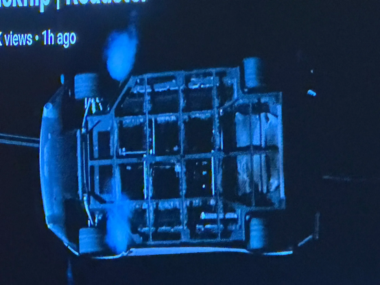 Underside of the stupid vacuum car which is showing bare metal frame, so it really is just a hollow shell. Honestly I don't even know if they did it real at this point, even if they Could have. Really not worth thinking about, because again: dude's a fascist prick.