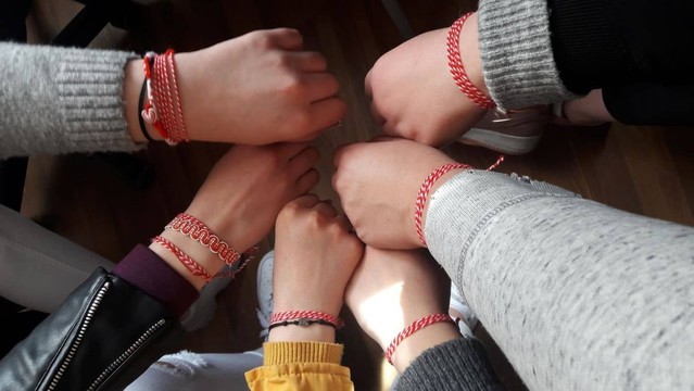 Hands with martenitsa bracelets. Taken from https://www.yesprograms.org/stories/celebrating-a-bulgarian-tradition-with-a-twist