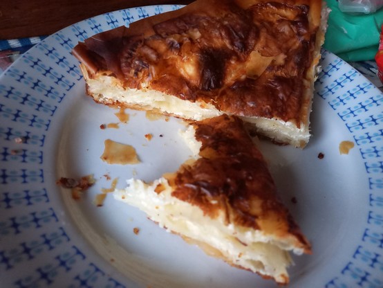 Two triangular pieces of banitsa on a platter. Smell: like two slices of heaven.