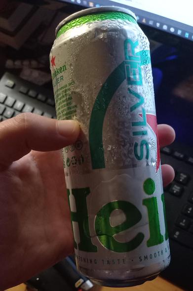 A Heineken Silver sweating it out, partly thawed.