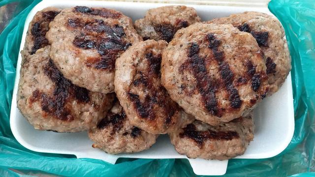 10 barbecued meatballs in a Styrofoam container.