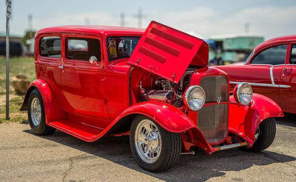 A red 1932 Ford Tudor Sedan Hot Rod with Big Block Ford Engine in a parking lot:

https://en.wikipedia.org/wiki/1932_Ford#/media/File:32tudorred.jpg